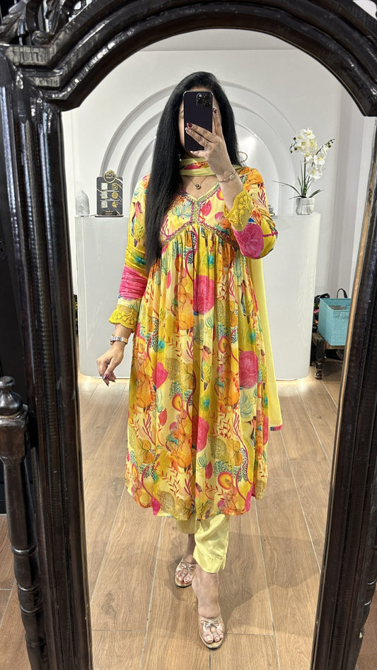 Yellow floral alia cut chinnon frock with embroidery detailing on the yoke